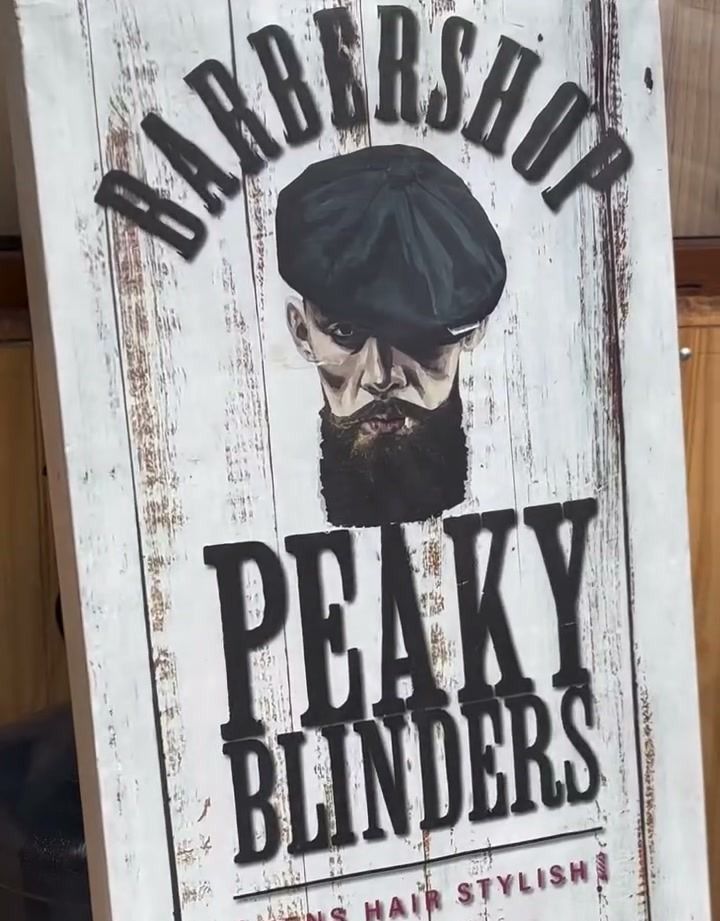Cartel de vereda de la barbería con el logotipo y una flecha